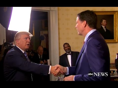 Comey “disgusted” when Trump hugged him – Tried to disappear in drapes.