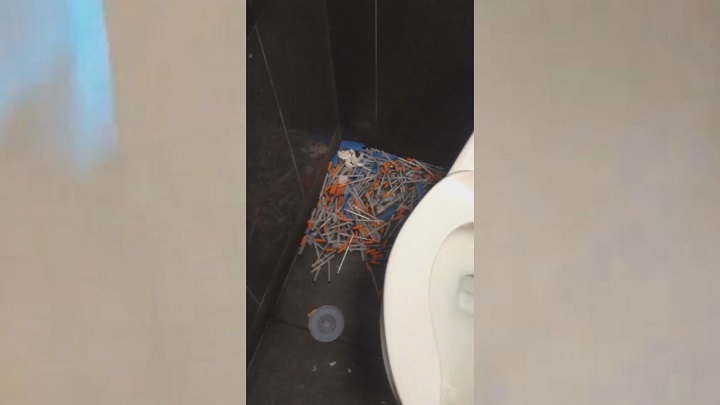 Viral video shows woman discovering pile of needles in McDonald’s bathroom