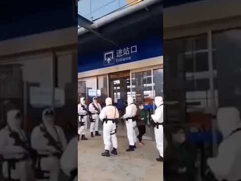 WATCH: Armored Guard in Chemical Protection Suit at Wuhan Terminal